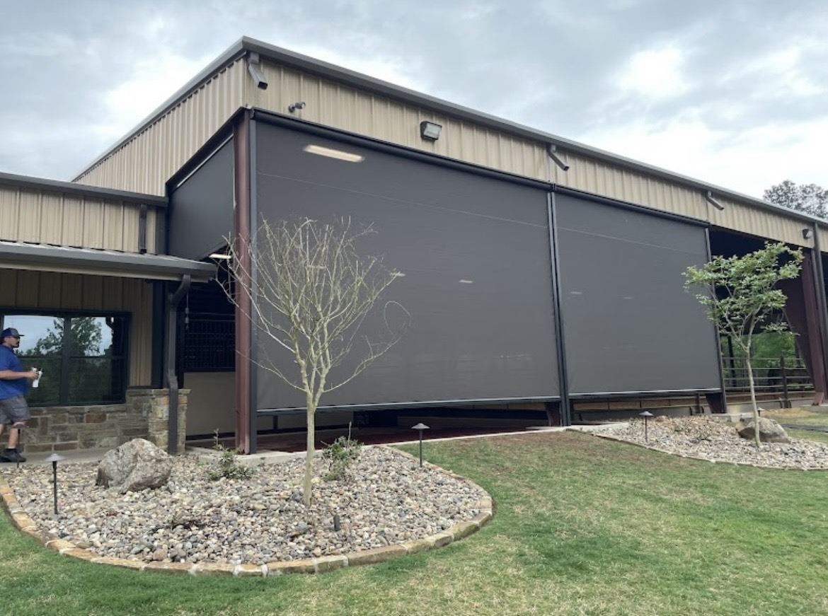 Motorized screens along the covered patio of a DFW home