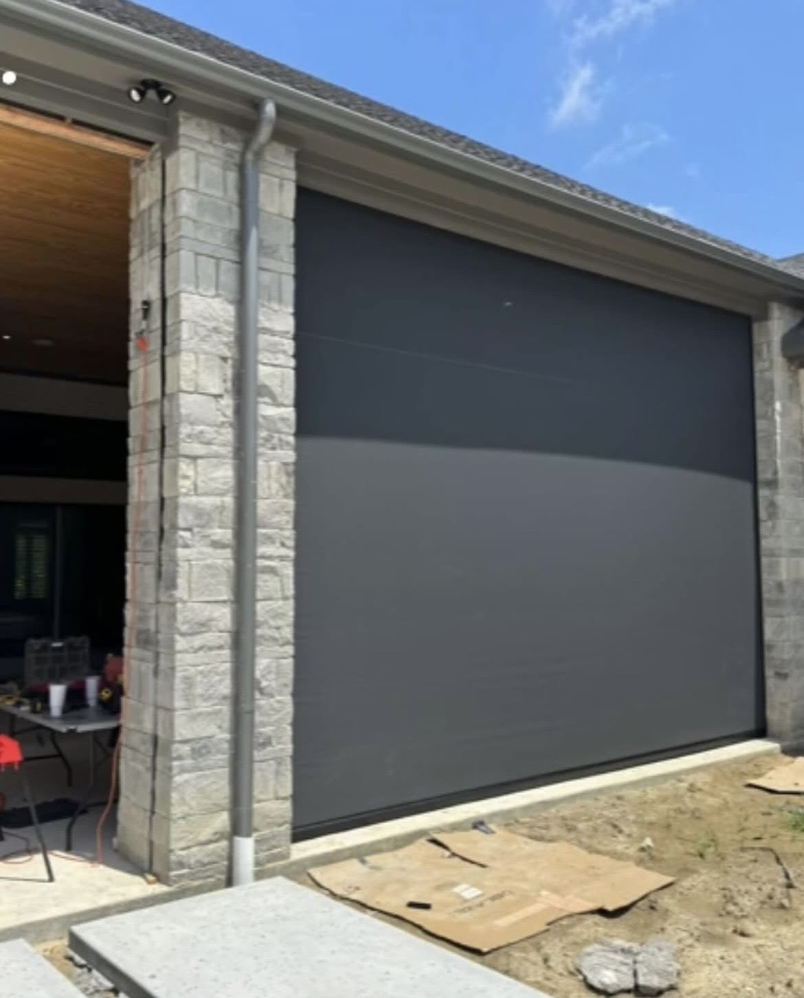 Stone DFW home fitted with motorized patio screens
